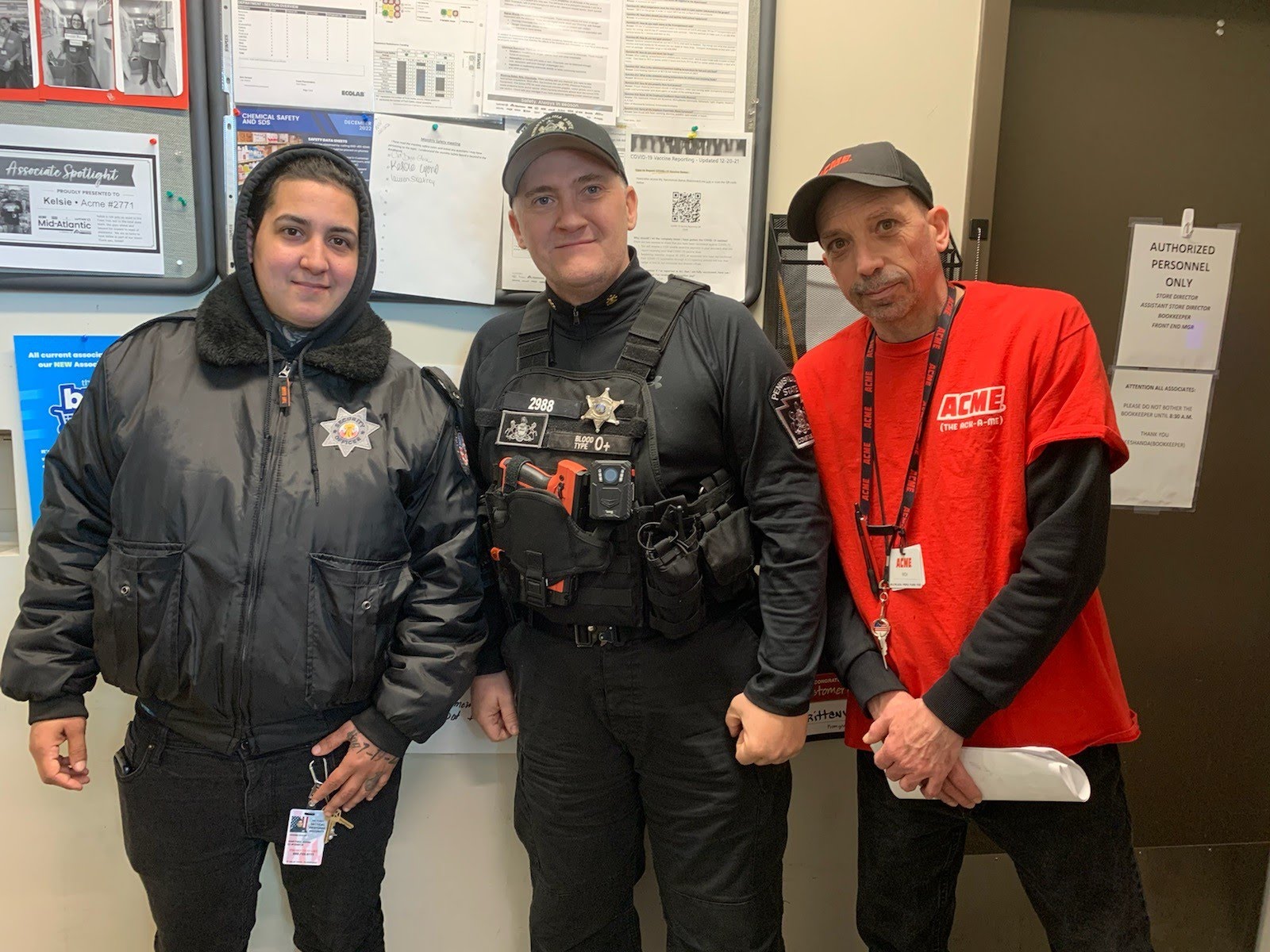 Constable Kregiel with store staff and security